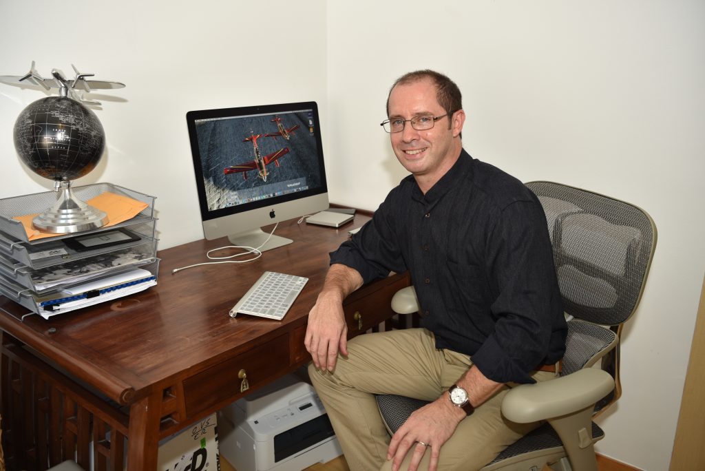 Author Thomas A Squire at desk